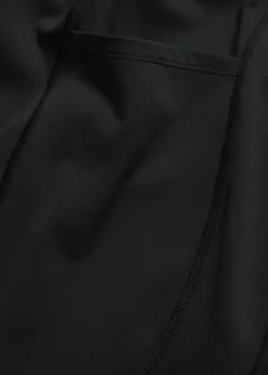 Cómodos leggings deportivos con bolsillo para móvil, corte acampanado y material de secado rápido