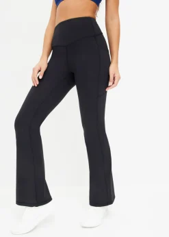 Cómodos leggings deportivos con bolsillo para móvil, corte acampanado y material de secado rápido