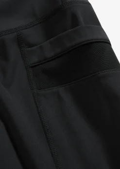 Cómodos leggings deportivos con malla y bolsillo para móvil