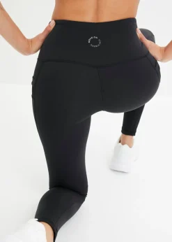 Cómodos leggings deportivos con malla y bolsillo para móvil