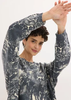 Jersey con mangas tipo murciélago y estampado de serpiente