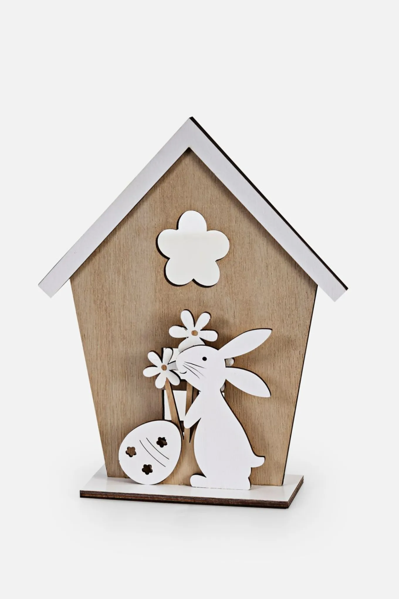 Objeto decorativo en forma de conejito de Pascua con casita