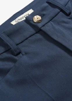 Pantalón 7/8 acampanado con botón decorativo