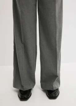 Pantalón ancho de pliegues