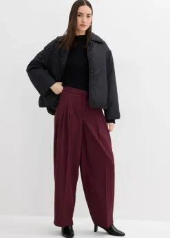 Pantalón con pinzas, cinturilla cómoda y abertura