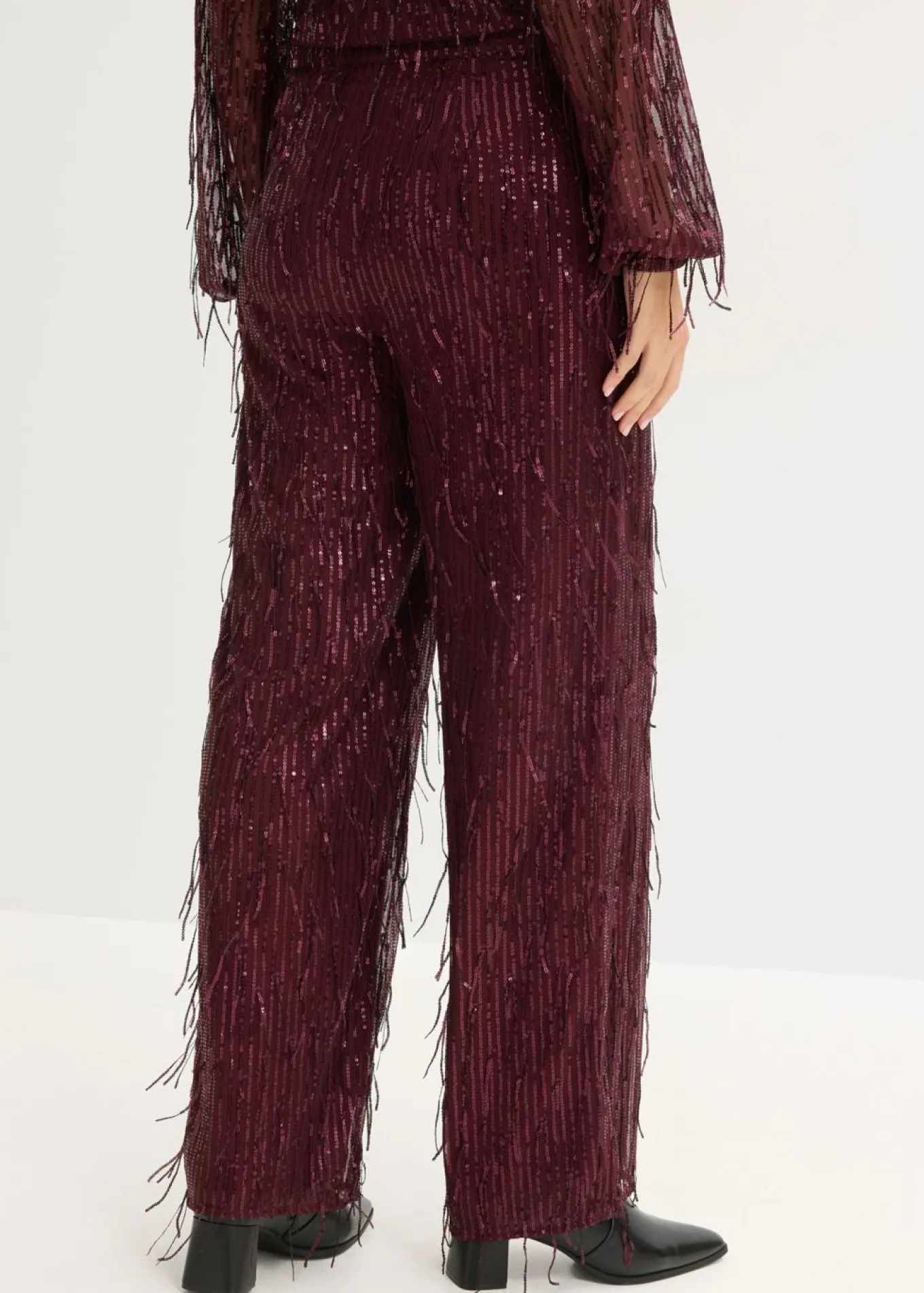 Pantalón de lentejuelas con flecos