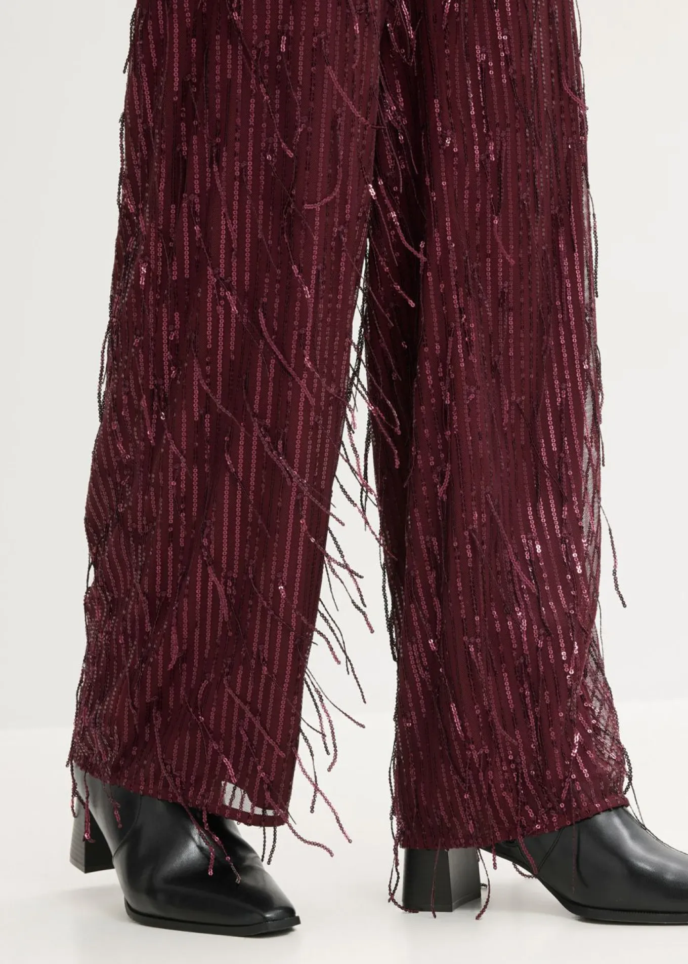 Pantalón de lentejuelas con flecos