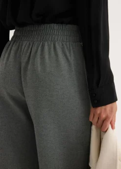 Pantalón de punto con cierre decorativo