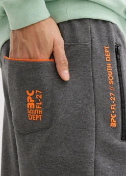 Pantalones de chándal con prácticos bolsillos con cremallera, confeccionados en algodón orgánico