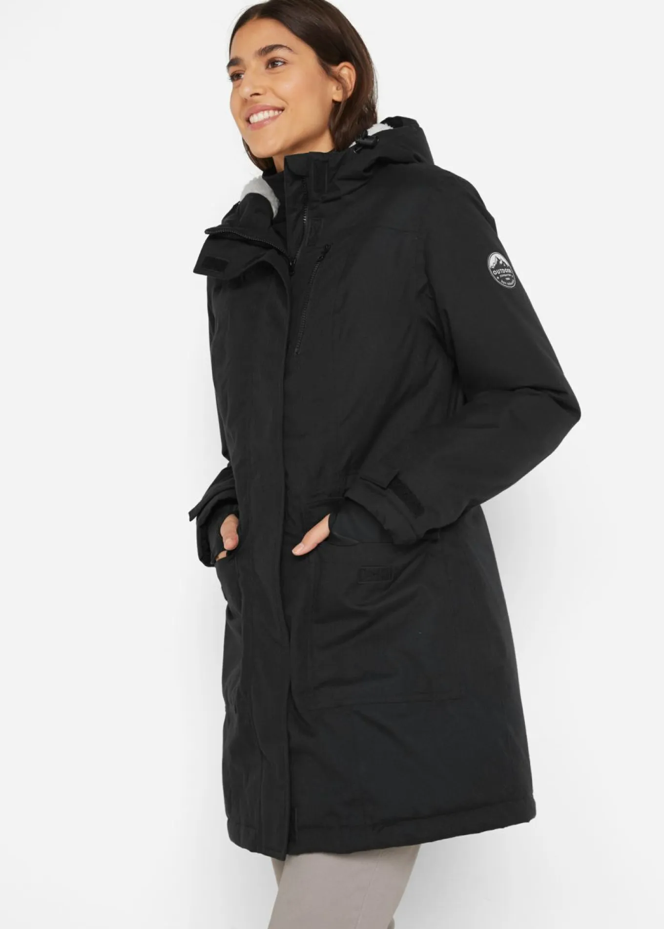 Parka funcional impermeable con forro de peluche en la capucha