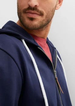 Sudadera con capucha y detalles de piel sintética