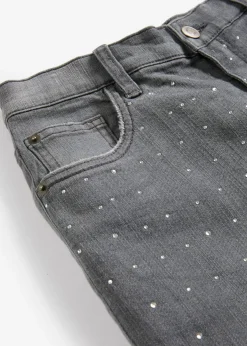 Vaqueros con perneras anchas, piedras brillantes y talle medio