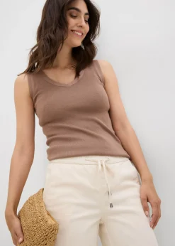 Vaqueros de corte barrel, mid waist, cintura cómoda