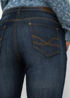 Vaqueros elásticos con corte mom y talle medio