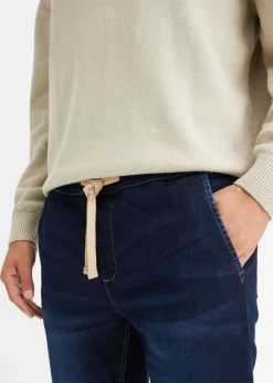 Vaqueros informales con corte regular, forma tapered y cinturilla elástica