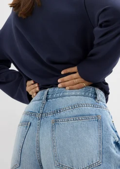 Vaqueros low stretch con perneras anchas y tiro medio