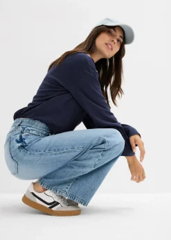 Vaqueros low stretch con perneras anchas y tiro medio