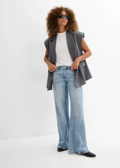 Vaqueros low stretch con corte holgado, talle medio y diseño recto