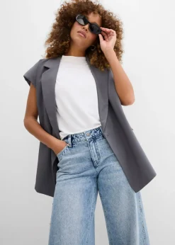 Vaqueros low stretch con corte holgado, talle medio y diseño recto