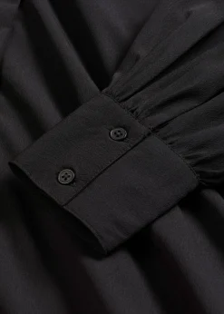 Vestido camisero con lazo en el cuello