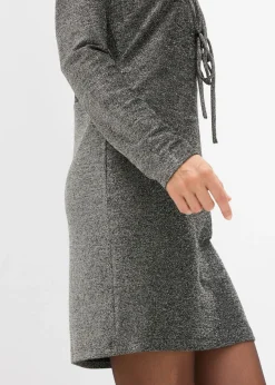 Vestido corto con material brillante y detalle de lazo
