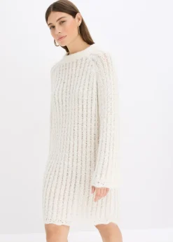 Vestido corto de punto con lazo de satén y ligeras transparencias
