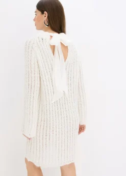Vestido corto de punto con lazo de satén y ligeras transparencias