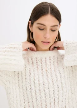 Vestido corto de punto con lazo de satén y ligeras transparencias
