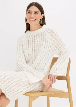 Vestido corto de punto con lazo de satén y ligeras transparencias