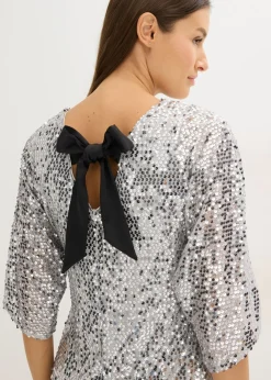 Vestido de lentejuelas con detalle de lazo