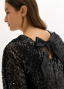 Vestido de lentejuelas con detalle de lazo