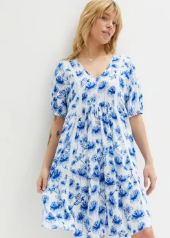 Vestido tipo túnica hasta la rodilla con detalles de encaje