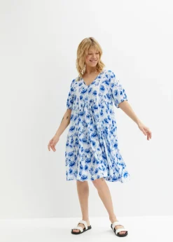 Vestido tipo túnica hasta la rodilla con detalles de encaje