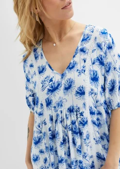 Vestido tipo túnica hasta la rodilla con detalles de encaje